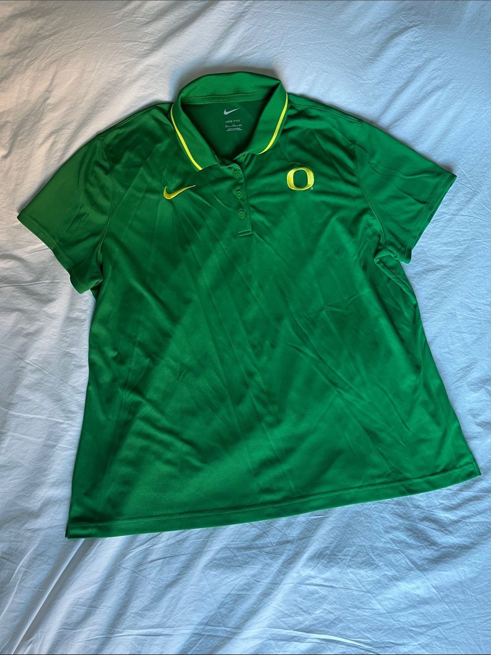Nike Women’s Green Polo Shirt with Yellow Embroidered Accents